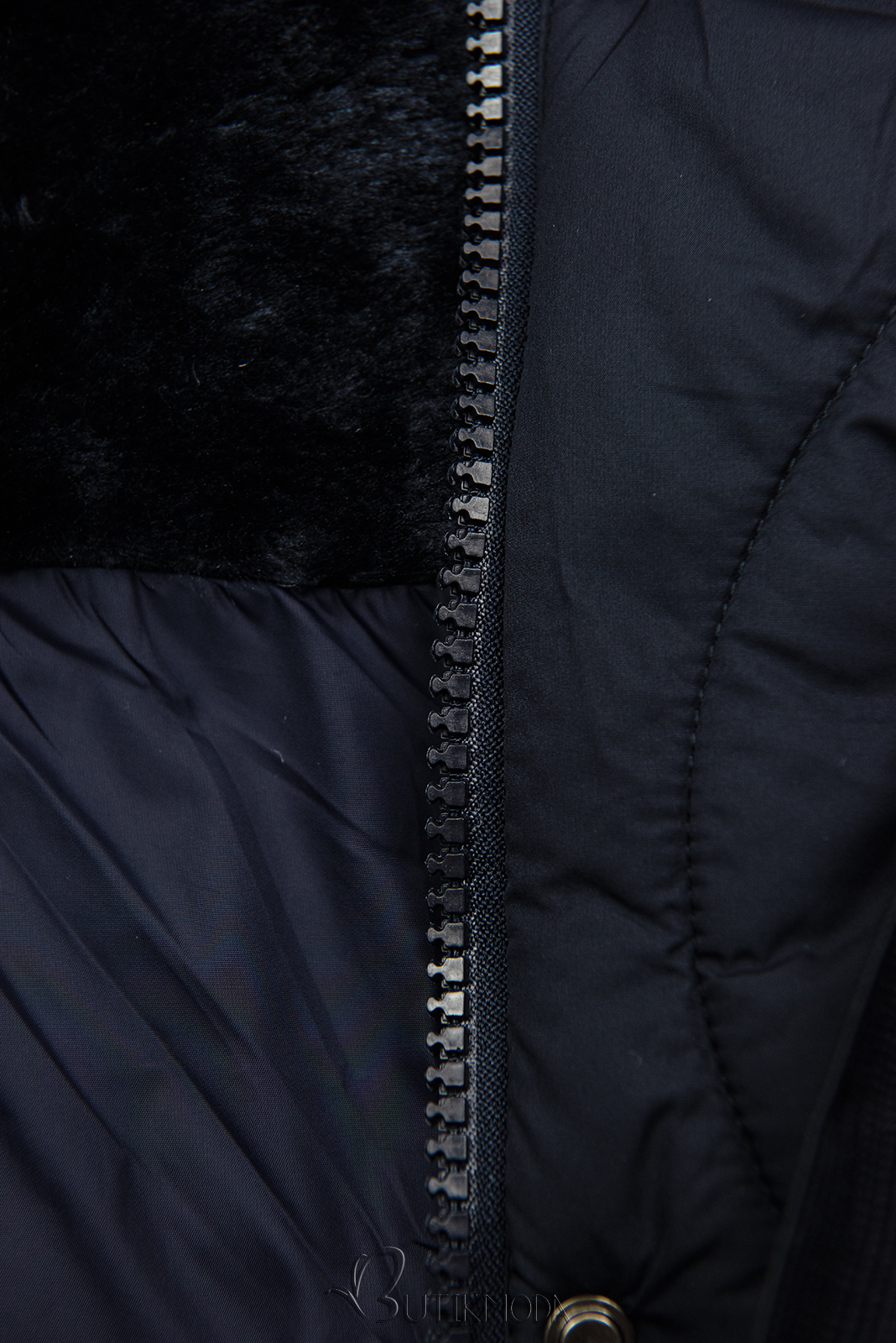 Jachetă bleumarin matlasată cu șnur în talie